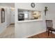 Kitchen with pass-through to dining area and hardwood floors at 3521 Teeside Dr # 3521, New Port Richey, FL 34655