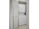 Convenient laundry room with stacked washer and dryer at 3521 Teeside Dr # 3521, New Port Richey, FL 34655