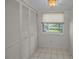 Laundry room with built-in shelving and window at 3521 Teeside Dr # 3521, New Port Richey, FL 34655