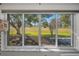 Large window showcasing a scenic golf course view at 3521 Teeside Dr # 3521, New Port Richey, FL 34655