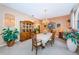 Formal dining room with a wood hutch and stylish light fixture at 3995 Wellington Pkwy, Palm Harbor, FL 34685