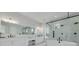 Modern bathroom with double vanity, large shower, and soaking tub at 4306 W Barcelona St, Tampa, FL 33629