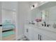 Double vanity bathroom with white cabinets and black fixtures at 4306 W Barcelona St, Tampa, FL 33629