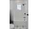 Bathroom with white subway tiles, a shower/tub combo and patterned floor at 4306 W Barcelona St, Tampa, FL 33629