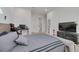 Bedroom with a bed, gaming setup, and a TV at 4306 W Barcelona St, Tampa, FL 33629
