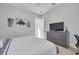 Cozy bedroom with a comfortable bed, dresser, and hardwood floors at 4306 W Barcelona St, Tampa, FL 33629