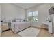 Light and bright bedroom with a daybed, vanity, and mirrored dresser at 4306 W Barcelona St, Tampa, FL 33629