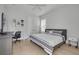 Bright bedroom with comfortable bed, workspace, and hardwood floors at 4306 W Barcelona St, Tampa, FL 33629