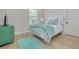 Bedroom with a bed, teal bedding and rug, and a green dresser at 4306 W Barcelona St, Tampa, FL 33629