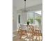 Bright breakfast nook with white table and chairs, and natural light at 4306 W Barcelona St, Tampa, FL 33629