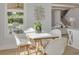 Breakfast nook with white table and chairs near a window at 4306 W Barcelona St, Tampa, FL 33629