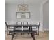 Formal dining room with a sleek wooden table and stylish light fixture at 4306 W Barcelona St, Tampa, FL 33629