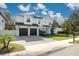 Two-story house with dark garage doors and a landscaped front yard at 4306 W Barcelona St, Tampa, FL 33629