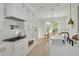 Modern kitchen with white cabinets, quartz countertops and a large window at 4306 W Barcelona St, Tampa, FL 33629