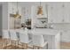 Modern kitchen with white cabinets, quartz countertops, and gold accents at 4306 W Barcelona St, Tampa, FL 33629