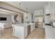 Modern kitchen with white cabinets, a large island, and stainless steel appliances at 4306 W Barcelona St, Tampa, FL 33629