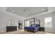 Spacious main bedroom with a four-poster bed, large closet, and hardwood floors at 4306 W Barcelona St, Tampa, FL 33629