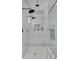 Large walk-in shower with multiple shower heads and built-in seat at 4306 W Barcelona St, Tampa, FL 33629