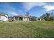 View of homes and large grassy backyard at 4661 Southern Valley Loop, Brooksville, FL 34601