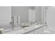 Bathroom with double vanity and a large mirror at 4661 Southern Valley Loop, Brooksville, FL 34601