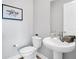 Clean bathroom with pedestal sink and toilet at 4661 Southern Valley Loop, Brooksville, FL 34601