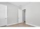Bright bedroom with neutral walls and wood-look floors at 4661 Southern Valley Loop, Brooksville, FL 34601