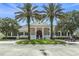Community clubhouse with palm trees and a golf cart at 4661 Southern Valley Loop, Brooksville, FL 34601