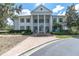 Elegant community center building with columns and landscaping at 4661 Southern Valley Loop, Brooksville, FL 34601