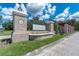 Brick entrance to Southern Hills community with iron gates and landscaping at 4661 Southern Valley Loop, Brooksville, FL 34601
