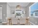 Bright dining room with wood table and neutral decor at 4661 Southern Valley Loop, Brooksville, FL 34601