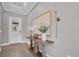 Bright entryway with wood console table, decor, and hardwood floors at 4661 Southern Valley Loop, Brooksville, FL 34601