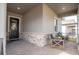 Covered front porch with seating area and stone wall detail at 4661 Southern Valley Loop, Brooksville, FL 34601