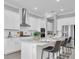 Modern kitchen with island, stainless steel appliances, and white cabinets at 4661 Southern Valley Loop, Brooksville, FL 34601
