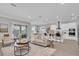 Open concept living and kitchen area with white cabinets and island at 4661 Southern Valley Loop, Brooksville, FL 34601