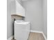 Laundry room with washer and dryer and white cabinets at 4661 Southern Valley Loop, Brooksville, FL 34601