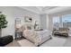Spacious main bedroom with sitting area and large windows at 4661 Southern Valley Loop, Brooksville, FL 34601