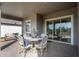 Covered patio with table and chairs, perfect for dining al fresco at 4661 Southern Valley Loop, Brooksville, FL 34601