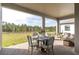 Spacious covered patio overlooking a beautiful backyard at 4661 Southern Valley Loop, Brooksville, FL 34601