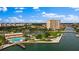 Aerial view showing community pool, clubhouse, and waterfront at 4900 Brittany S Dr # 409, St Petersburg, FL 33715