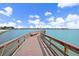 Scenic wooden pier extending over calm water at 4900 Brittany S Dr # 409, St Petersburg, FL 33715