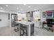 Modern kitchen with stainless steel appliances, island, and granite countertops at 4900 Brittany S Dr # 409, St Petersburg, FL 33715