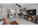 Open living area with kitchen and dining space, features hardwood floors at 4900 Brittany S Dr # 409, St Petersburg, FL 33715