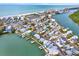 Aerial view of home with beach and waterfront access at 501 180Th E Ave, Redington Shores, FL 33708