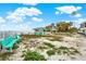 Beachfront view with picnic tables and benches at 501 180Th E Ave, Redington Shores, FL 33708