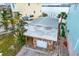 Detached garage with stone facade and ample parking space at 501 180Th E Ave, Redington Shores, FL 33708