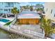 Detached garage with plywood siding and concrete pad at 501 180Th E Ave, Redington Shores, FL 33708