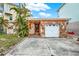 Single story home with stone accents and attached garage at 501 180Th E Ave, Redington Shores, FL 33708