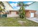 Single story home with stone accents and attached garage at 501 180Th E Ave, Redington Shores, FL 33708