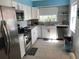 White kitchen with stainless steel appliances at 501 180Th E Ave, Redington Shores, FL 33708