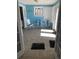 Bright sunroom with tiled floor and beachy decor at 501 180Th E Ave, Redington Shores, FL 33708